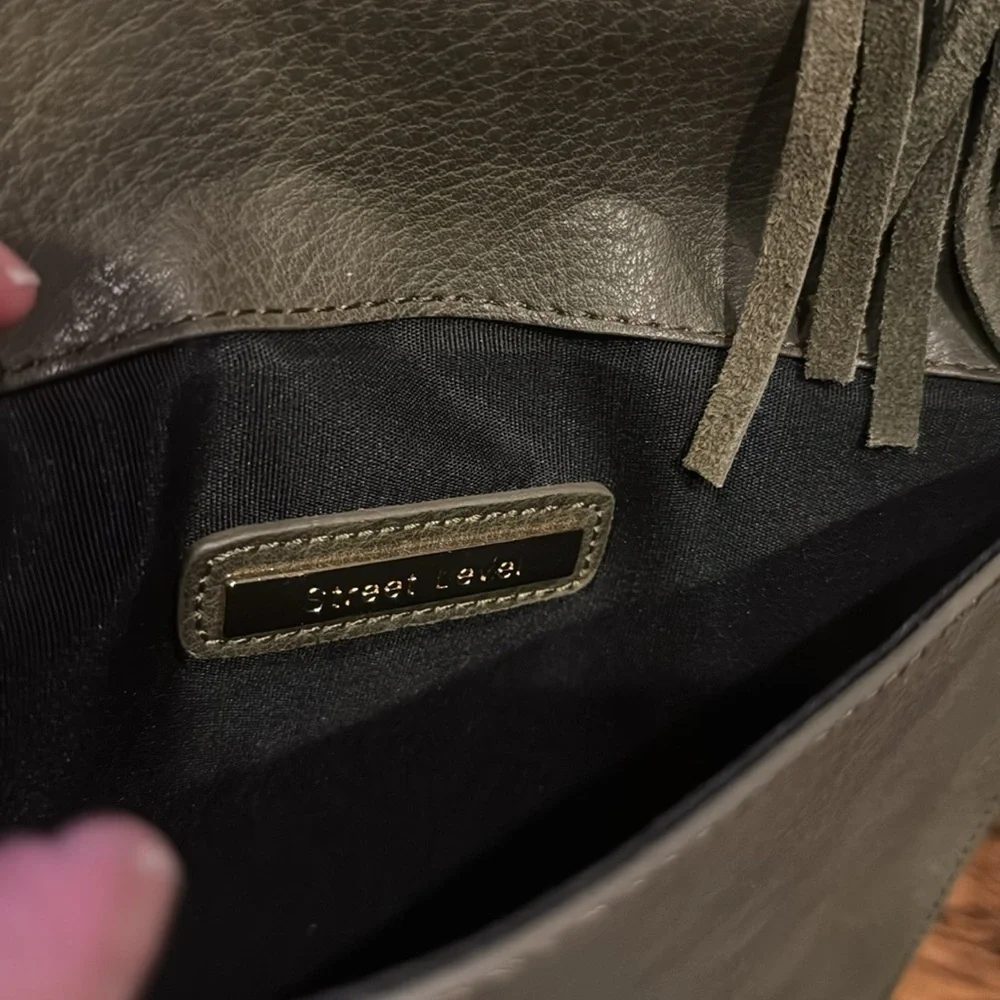 Anthropologie Street Level faux pebbled leather olive tasseled envelope clutch.
